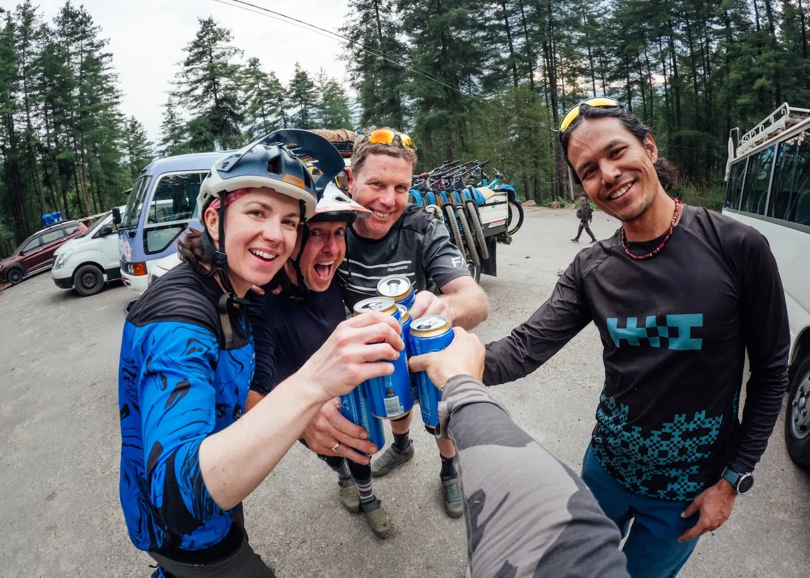 Mountain bikers drinking beer in Bhutan