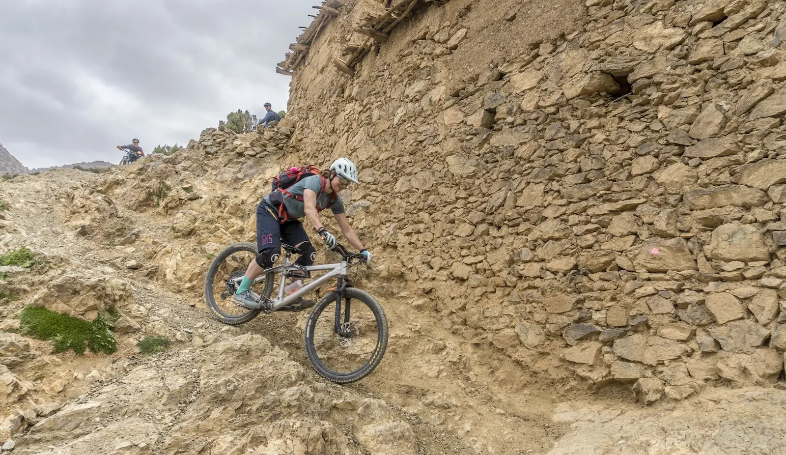 Female mountain biker descending trails in Morocco