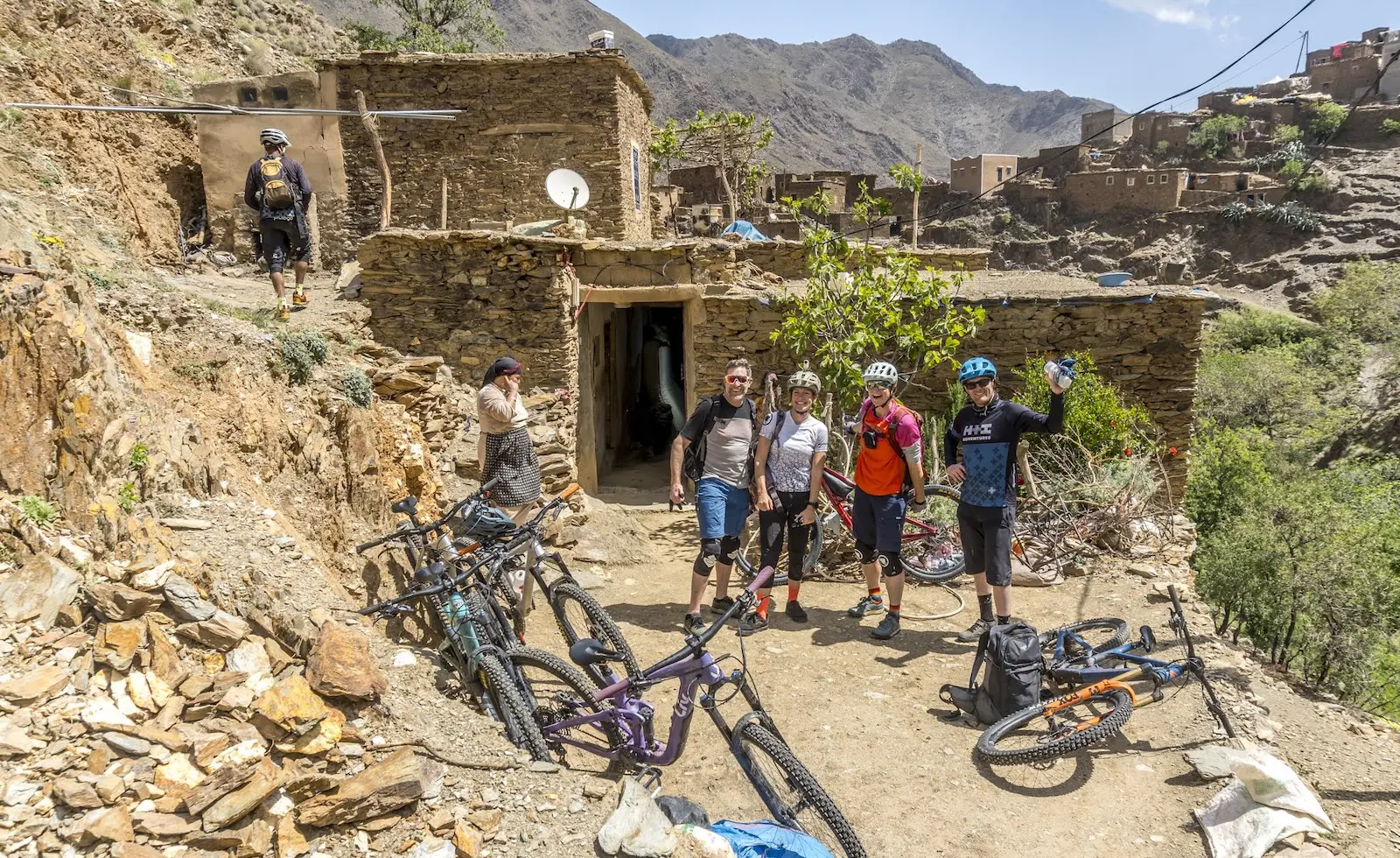 Mountain bikers in a village in Morocco