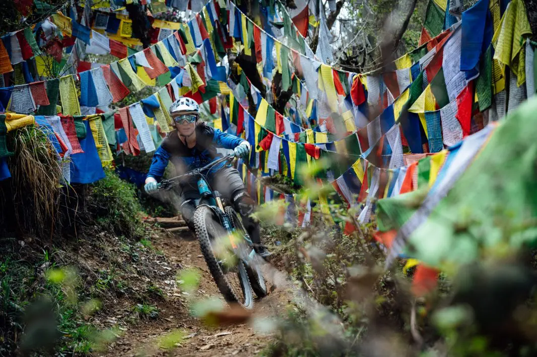 Ride through prayer flags in the Himalayas