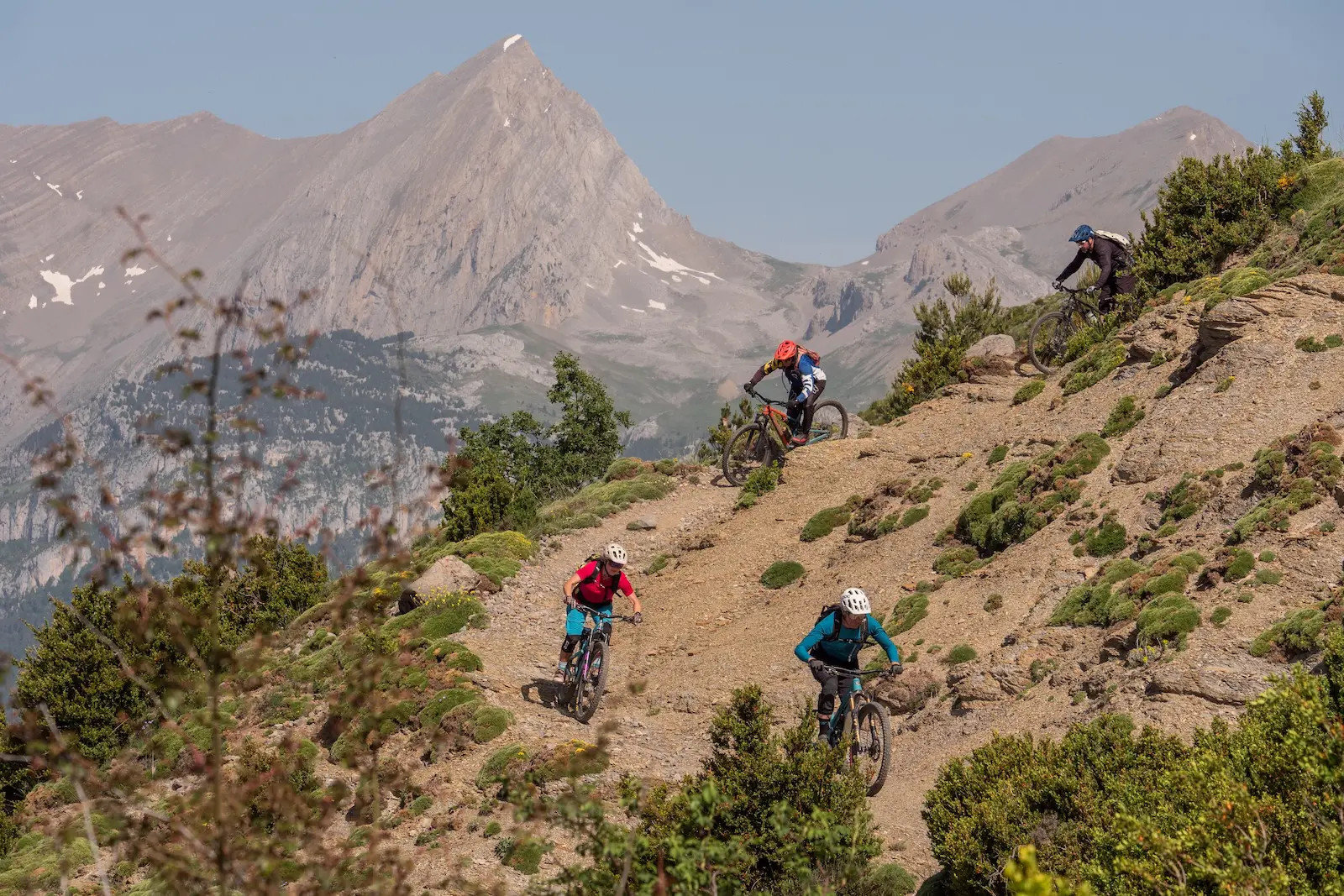 Mountain bikers and mountain peaks in the Pyrenees