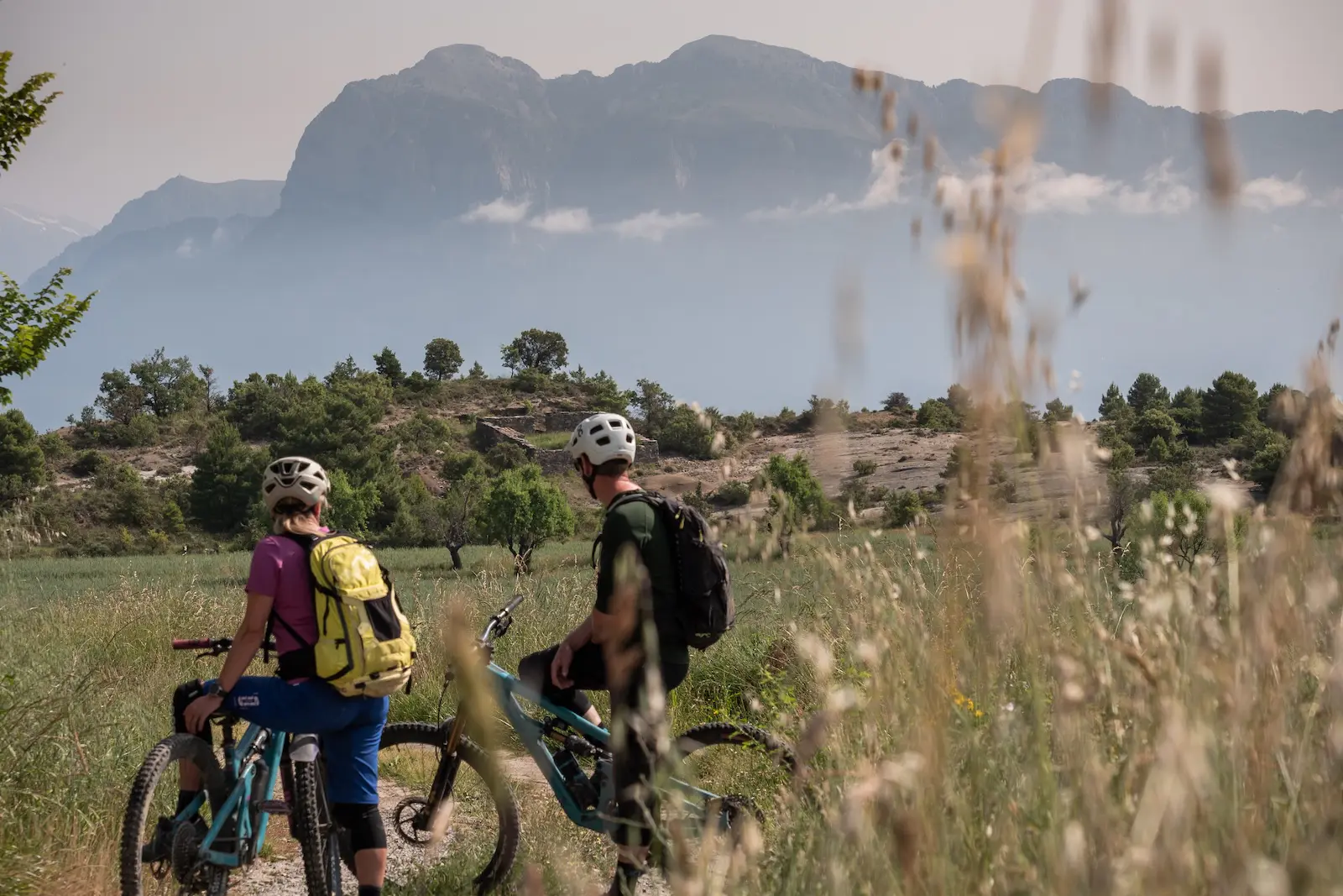 Mountain bikers admiring the Spanish Pyrenees mountains